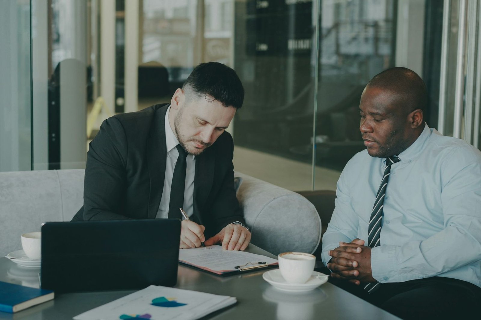 Business professionals reviewing an agreement